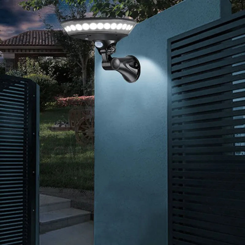 Outdoor 360-degree luminous solar security light with motion sensor mounted on a wall.