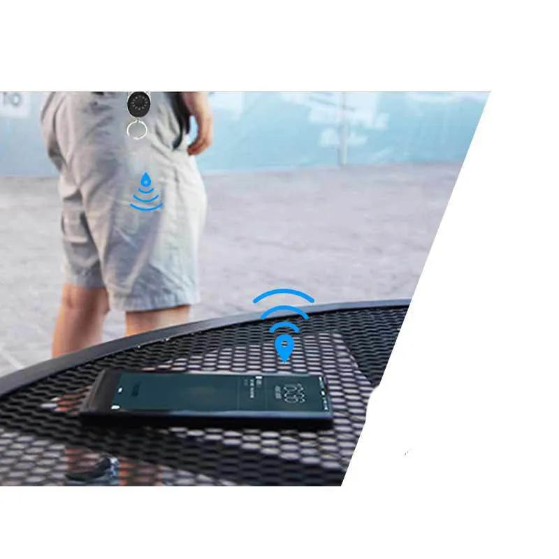 Black Bluetooth anti-lost tracker and selfie remote keychain compatible with Apple iPhone.