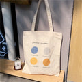 Women's canvas tote shoulder bag with geometric pattern, cotton lining, and zipper closure in light pink colour