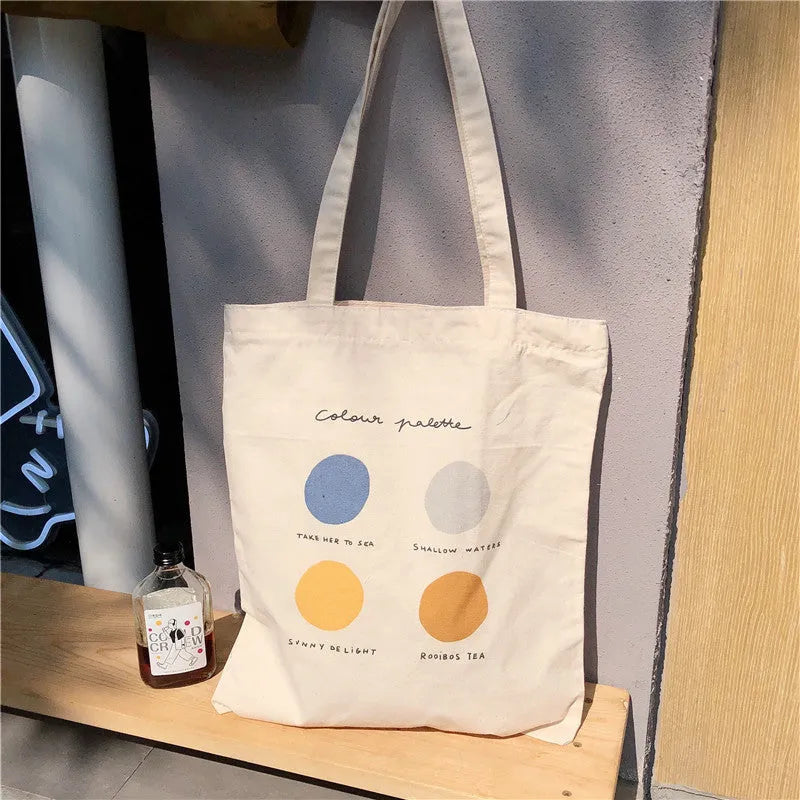 Women's canvas tote shoulder bag with geometric pattern, cotton lining, and zipper closure in light pink colour