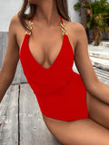Ladies one-piece swimsuit in solid colour nylon with chest pad, shown in red or black, sizes S M L