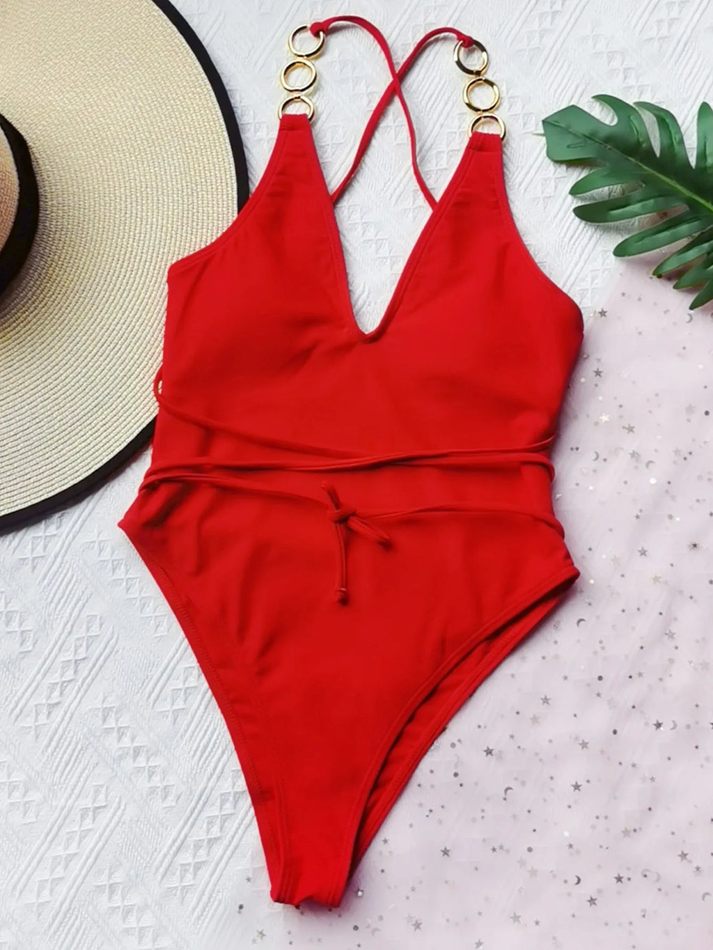 Ladies one-piece swimsuit in solid colour nylon with chest pad, shown in red or black, sizes S M L