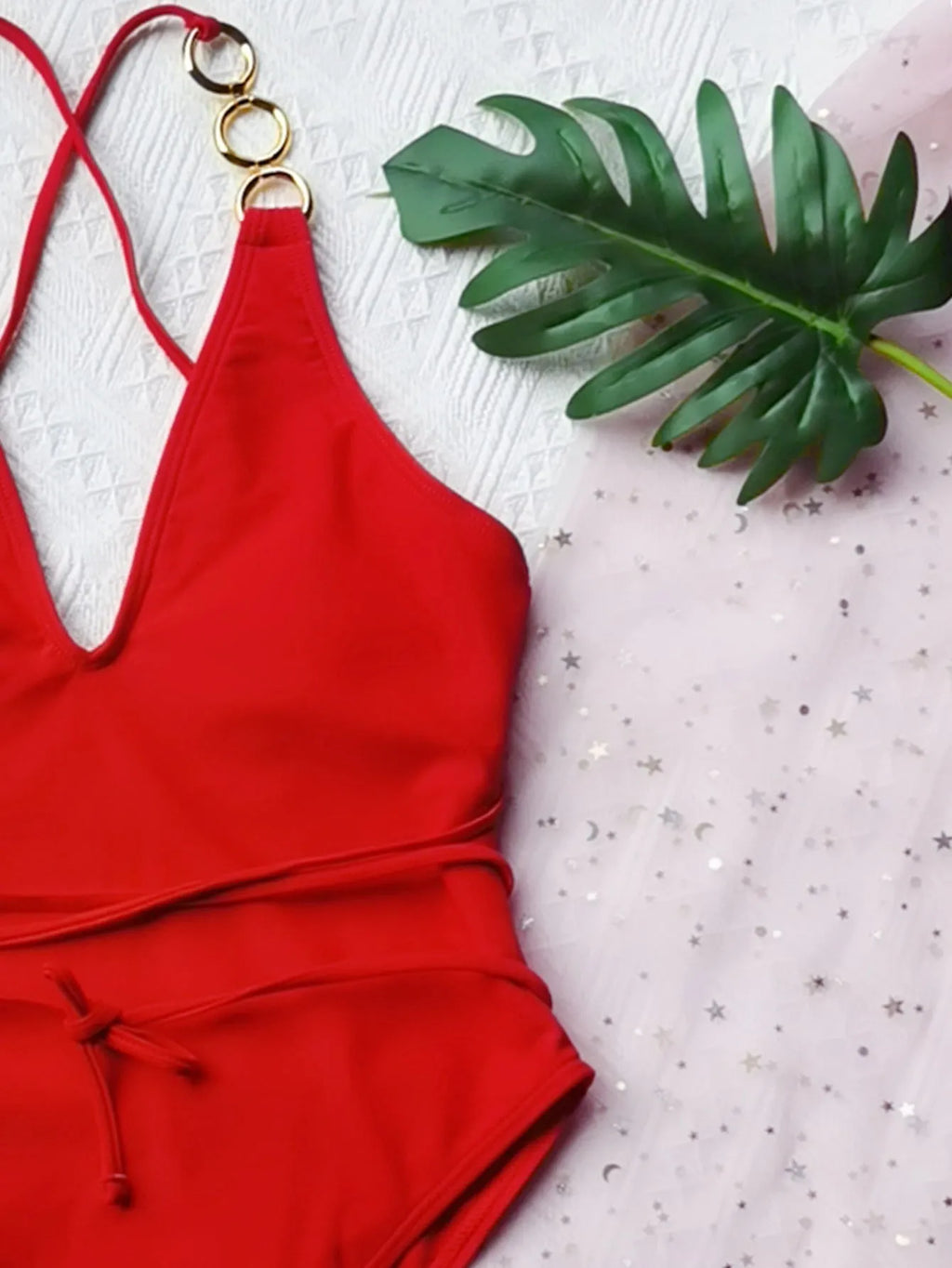 Ladies one-piece swimsuit in solid colour nylon with chest pad, shown in red or black, sizes S M L