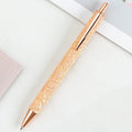 Metal push ballpoint pen with sequin design in multiple colours on white background