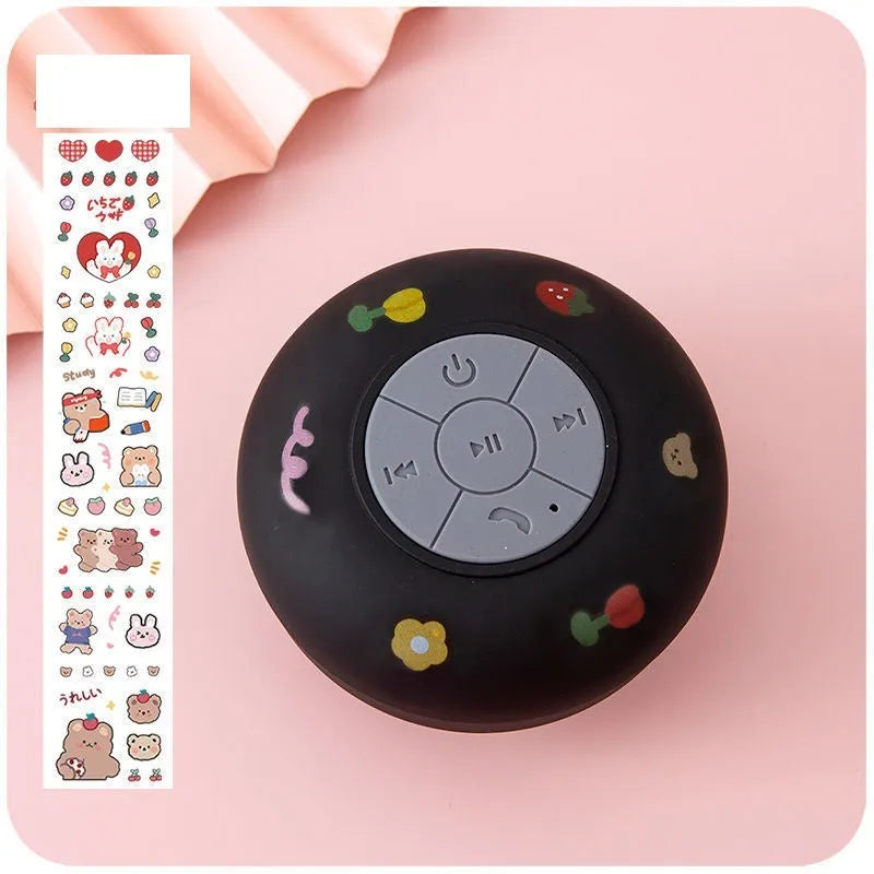 Waterproof Bluetooth mini speaker with silicone suction cup in black, blue, pink, white, or yellow colours