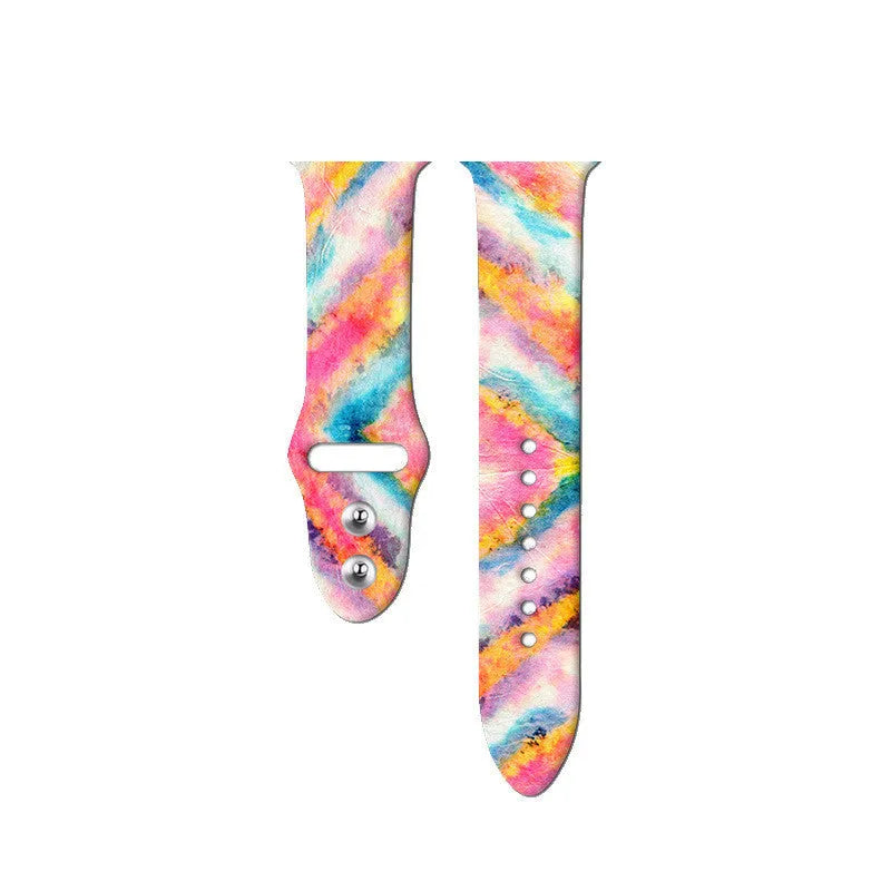 Colourful tie-dye patterned silicone replacement band for Apple Watch on a wrist.