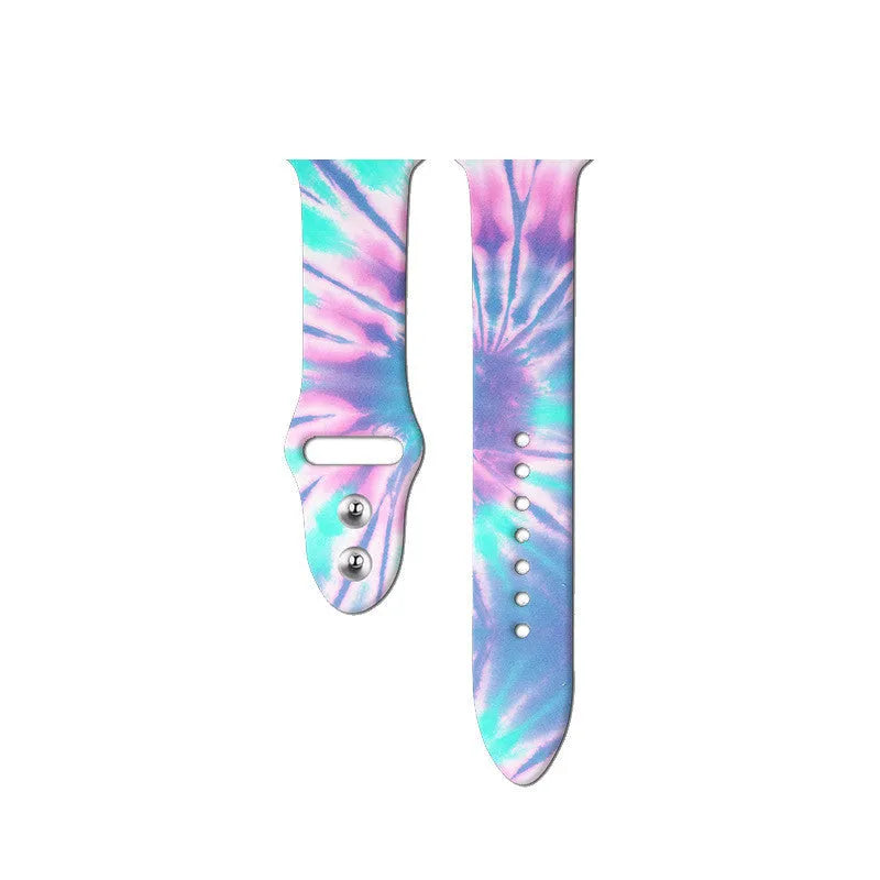 Colourful tie-dye patterned silicone replacement band for Apple Watch on a wrist.