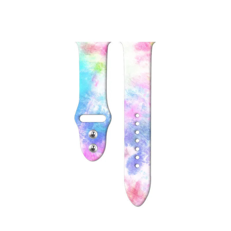 Colourful tie-dye patterned silicone replacement band for Apple Watch on a wrist.