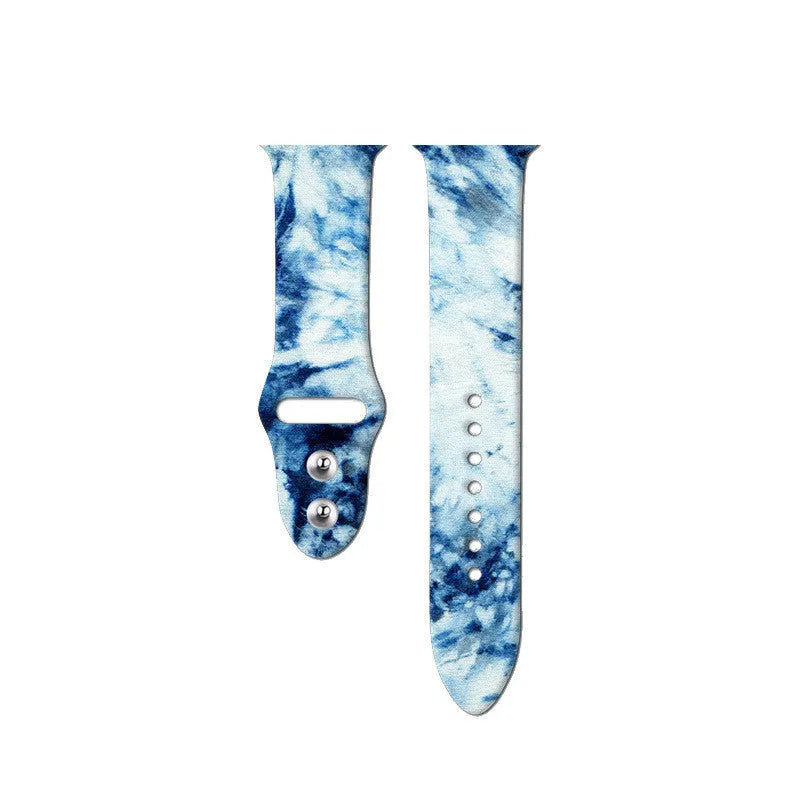 Colourful tie-dye patterned silicone replacement band for Apple Watch on a wrist.