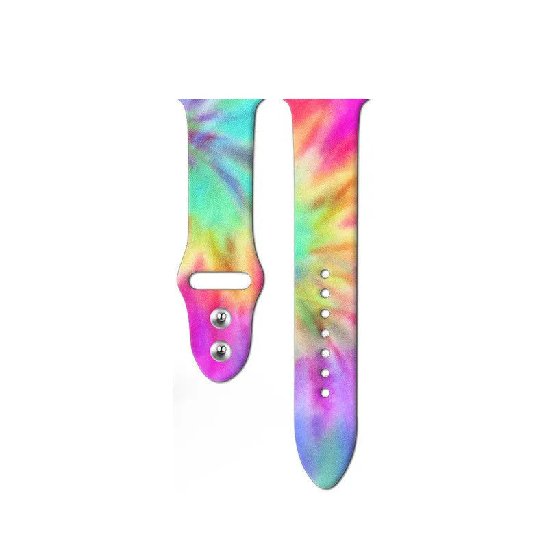 Colourful tie-dye patterned silicone replacement band for Apple Watch on a wrist.