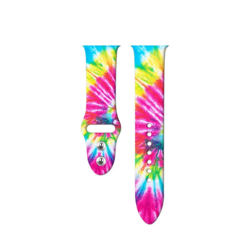 Colourful tie-dye patterned silicone replacement band for Apple Watch on a wrist.