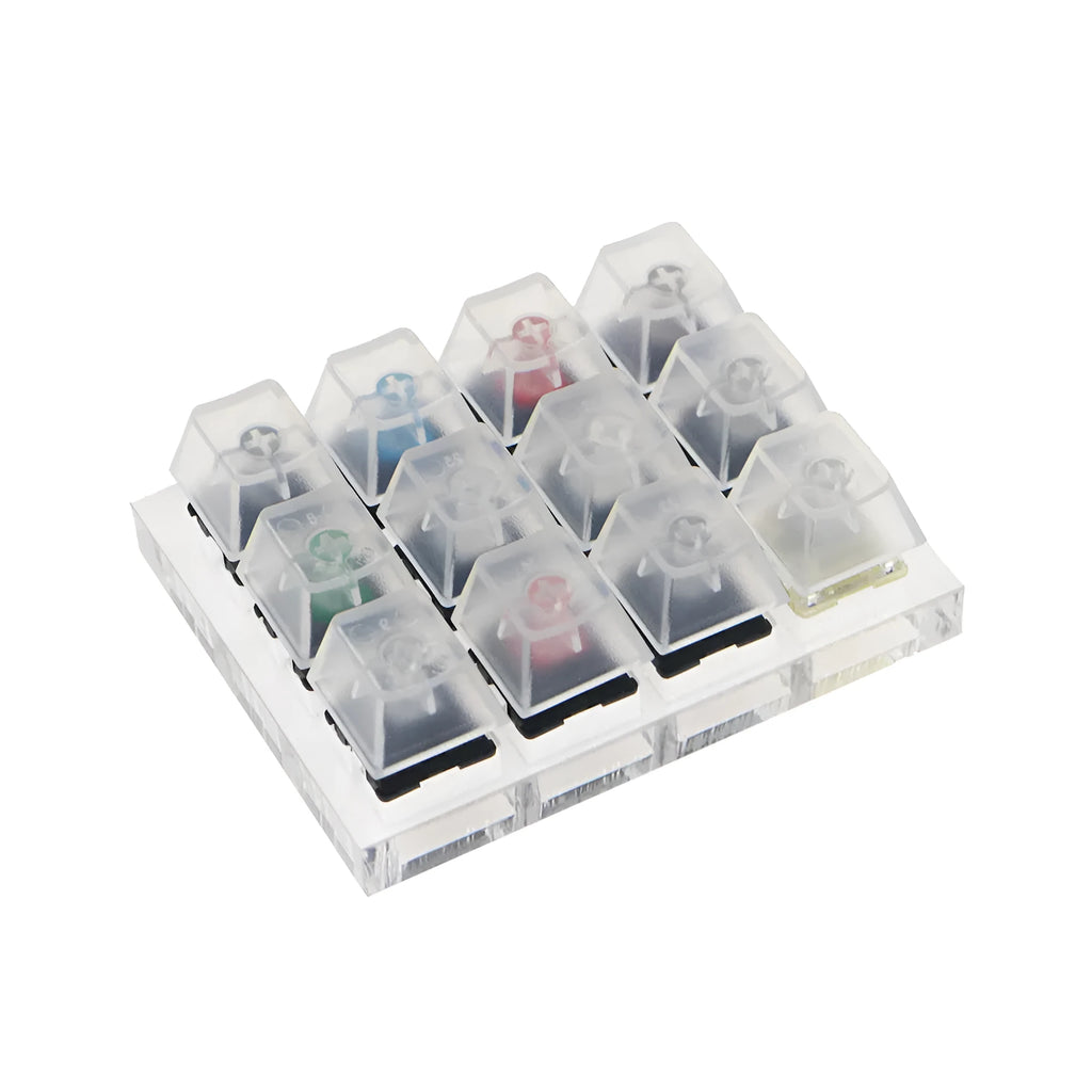 White mechanical keyboard switch tester with twelve different Cherry MX keys including black and green switches