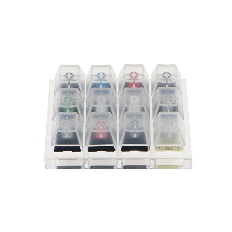 White mechanical keyboard switch tester with twelve different Cherry MX keys including black and green switches