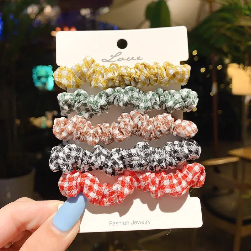 Set of children's hair rings and a head rope in assorted autumn and pastel colours.
