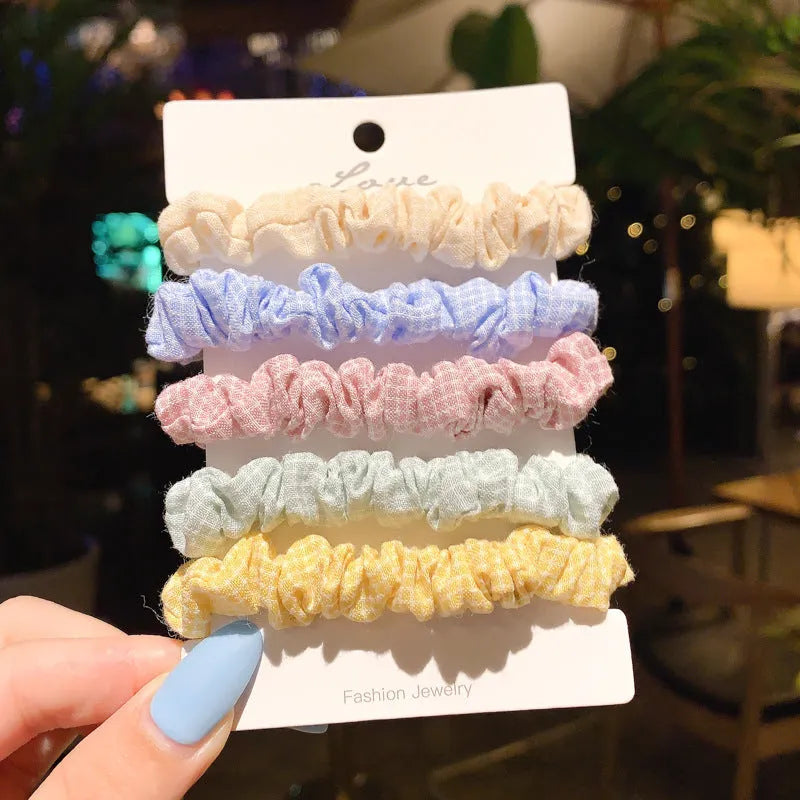 Set of children's hair rings and a head rope in assorted autumn and pastel colours.