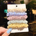 Set of children's hair rings and a head rope in assorted autumn and pastel colours.