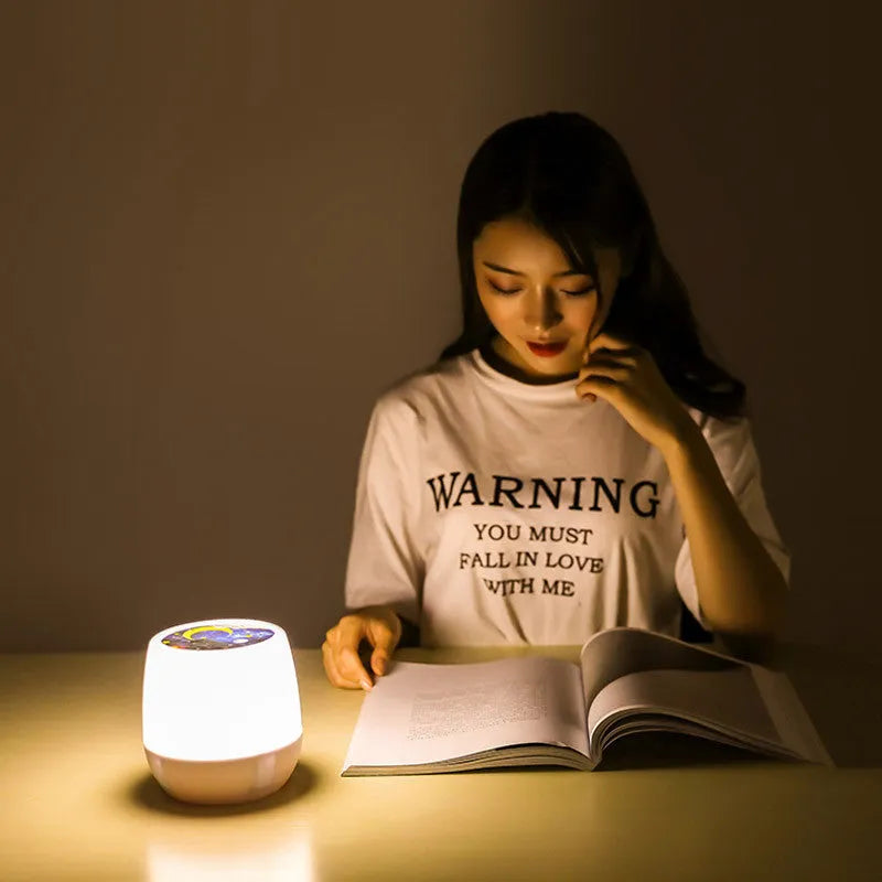 Pruixin rotating star projector night light showing star patterns on a bedroom ceiling.