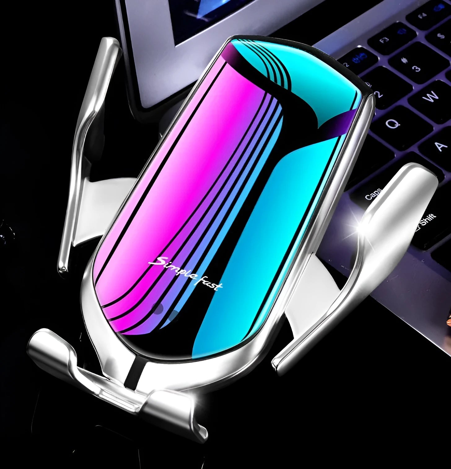 Magic Clip R1 automatic wireless charging car phone holder in silver mounted on a car air vent.