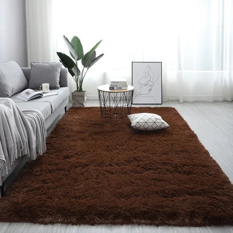 Nordic-style rectangular plush carpet with anti-slip base in beige colour on a wooden floor