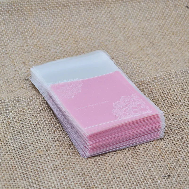 Clear self-adhesive plastic bag for handmade soap with pink UV printing and a 3cm side gusset.