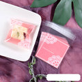 Clear self-adhesive plastic bag for handmade soap with pink UV printing and a 3cm side gusset.