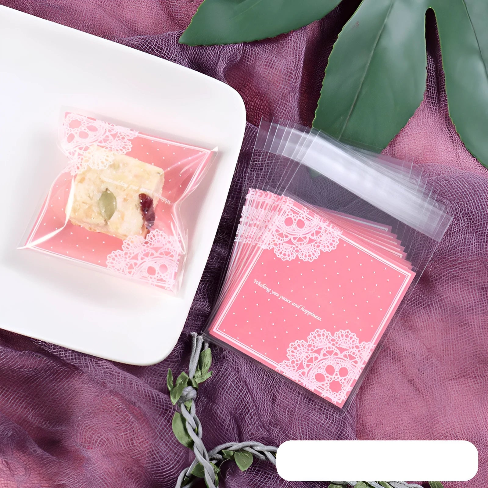 Clear self-adhesive plastic bag for handmade soap with pink UV printing and a 3cm side gusset.