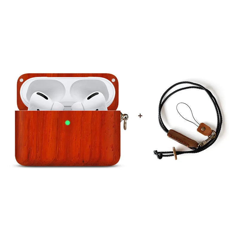 Solid walnut wood protective sleeve for Apple AirPods with attached brown lanyard on a wooden table.