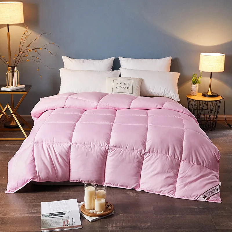 Goose down winter duvet in twill fabric, shown in a choice of colours including white, pink, beige, and grey.