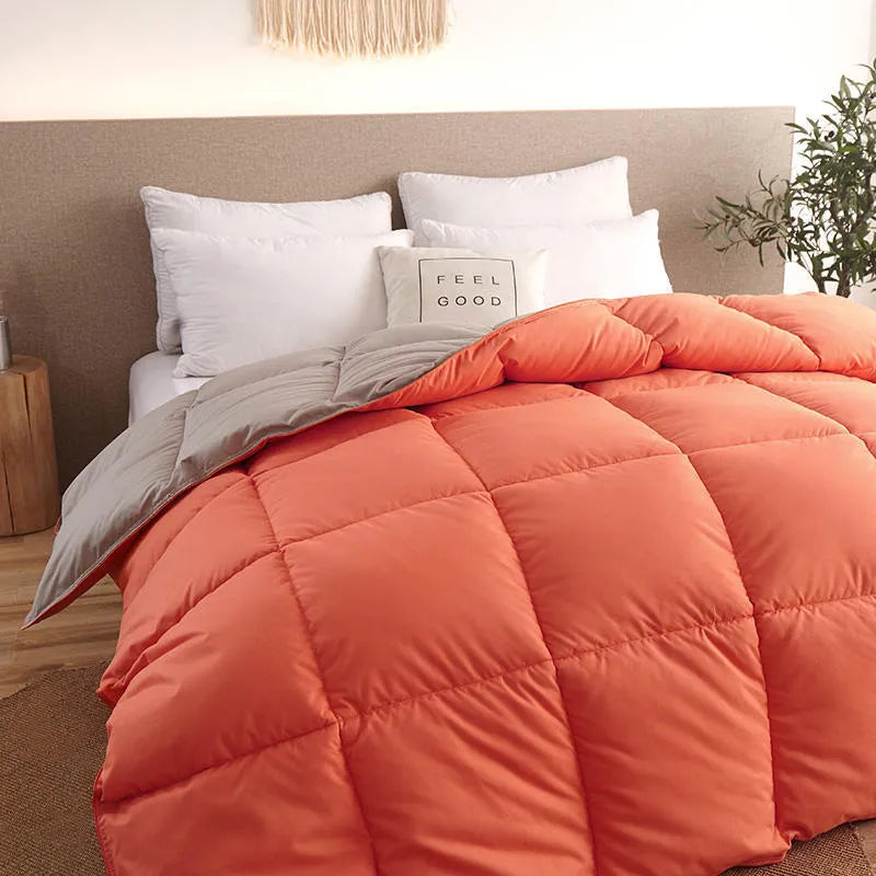 Goose down winter duvet in twill fabric, shown in a choice of colours including white, pink, beige, and grey.