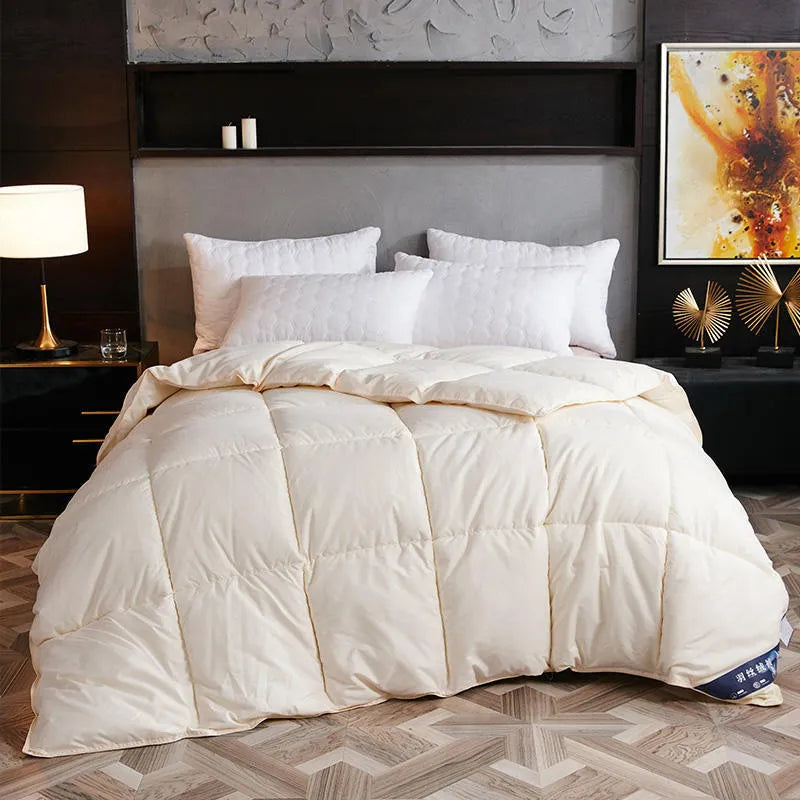 Goose down winter duvet in twill fabric, shown in a choice of colours including white, pink, beige, and grey.