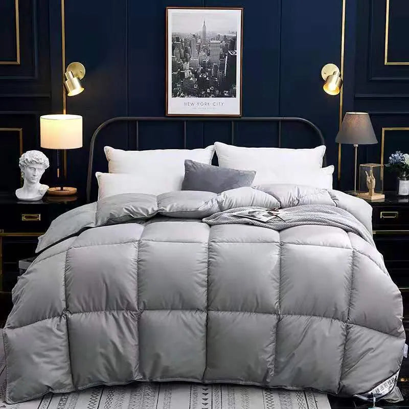 Goose down winter duvet in twill fabric, shown in a choice of colours including white, pink, beige, and grey.
