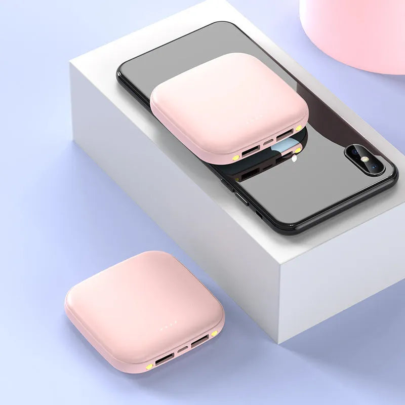 Compact black 20000 mAh mini power bank with LED flashlight on a plastic shell.