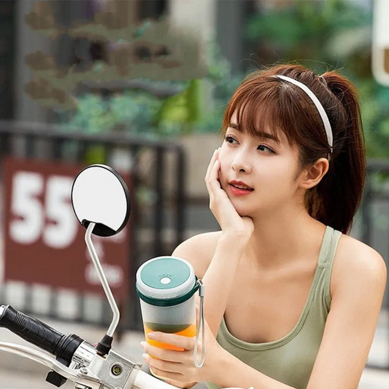 Portable pink USB rechargeable juicer cup with 400ml capacity and pulp collection box