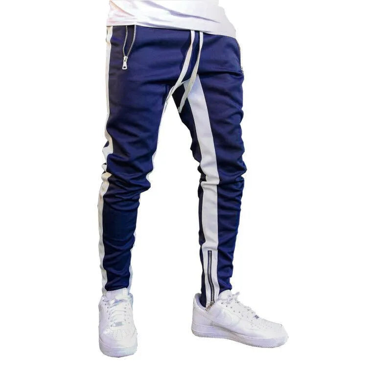 Men's strappy zippered high-waist tight-fit sports trousers in black and white on a model