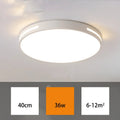 Round modern acrylic ceiling lamp with remote control in white light on a room ceiling.