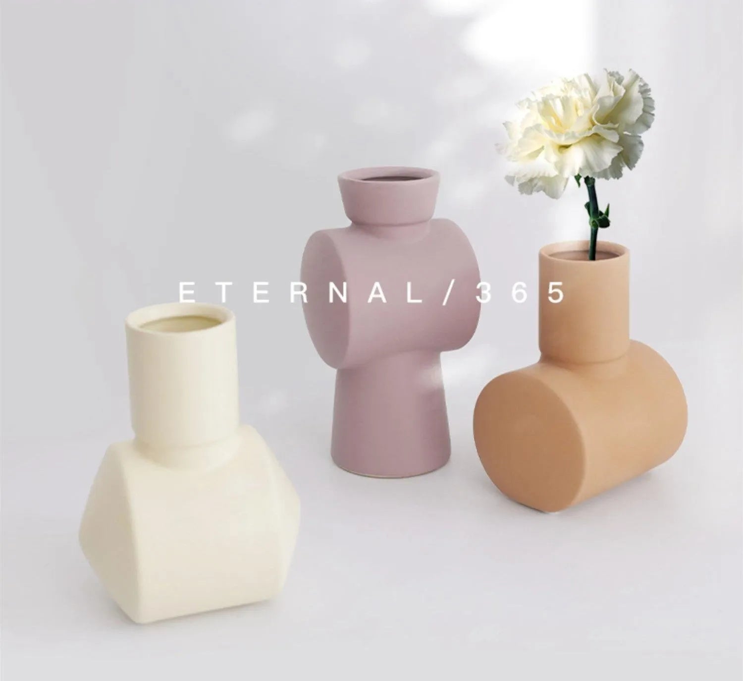 Nordic style hammered ceramic vase in Morandi beige, brown, or purple glaze on a cabinet.