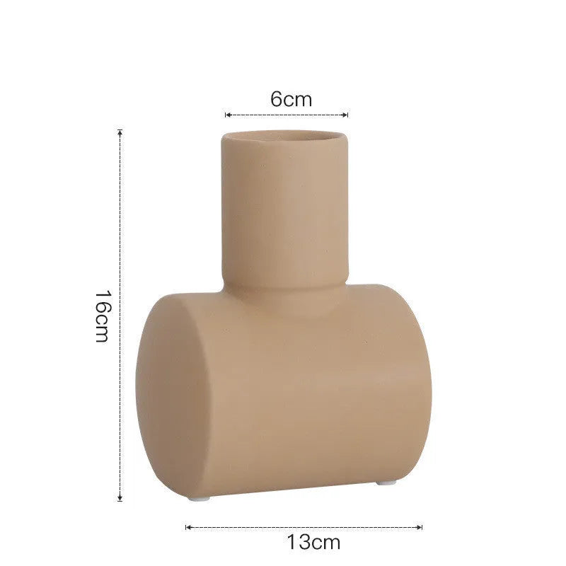 Nordic style hammered ceramic vase in Morandi beige, brown, or purple glaze on a cabinet.