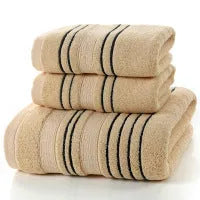 Pure cotton bath towel set showing one large bath towel and two smaller hand towels in matching colour