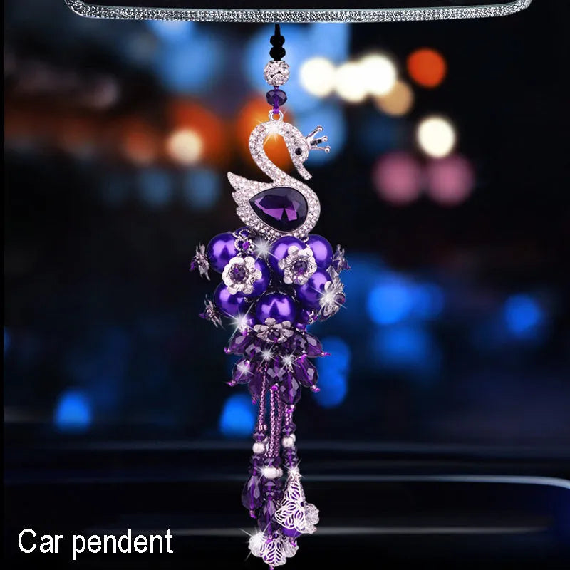 Round crystal diamond car aromatherapy pendant in purple swan style hanging from rearview mirror
