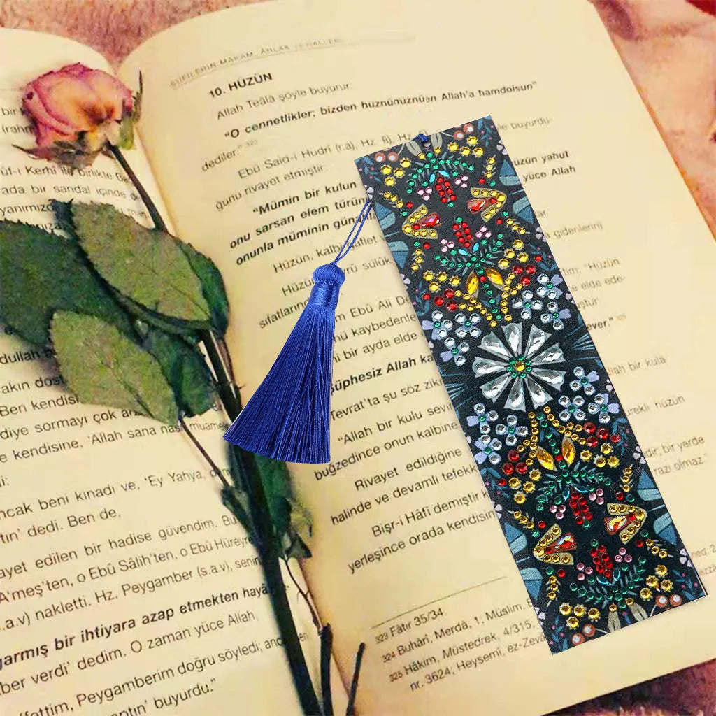 Handmade leather bookmark with diamond embroidered mandala flower design.
