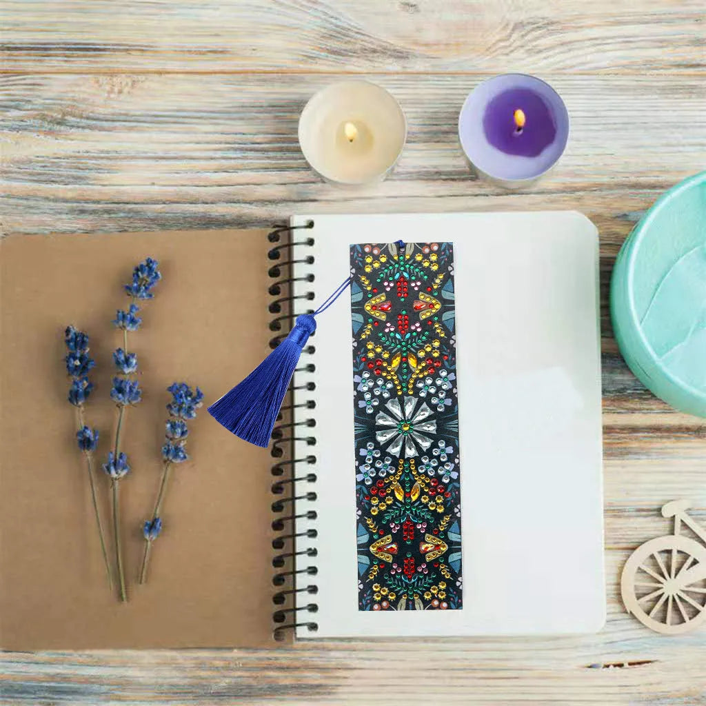 Handmade leather bookmark with diamond embroidered mandala flower design.