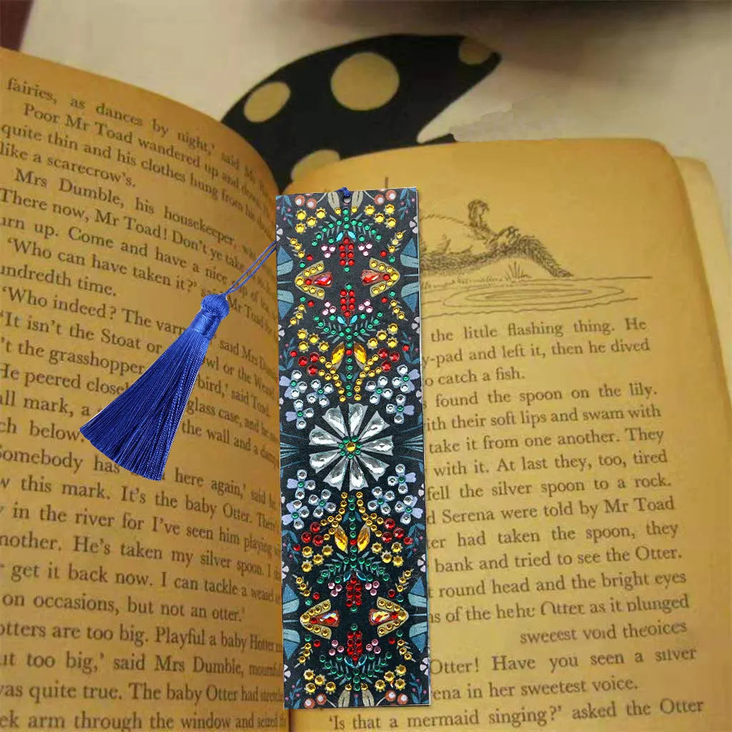 Handmade leather bookmark with diamond embroidered mandala flower design.