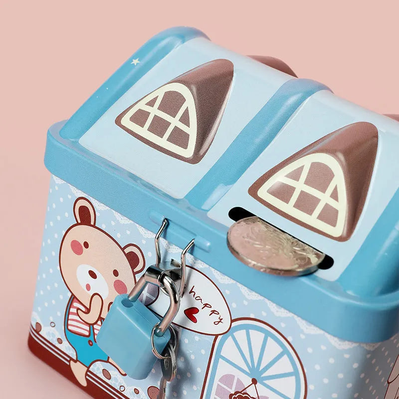 Blue house-shaped tinplate piggy bank on desktop for coin storage