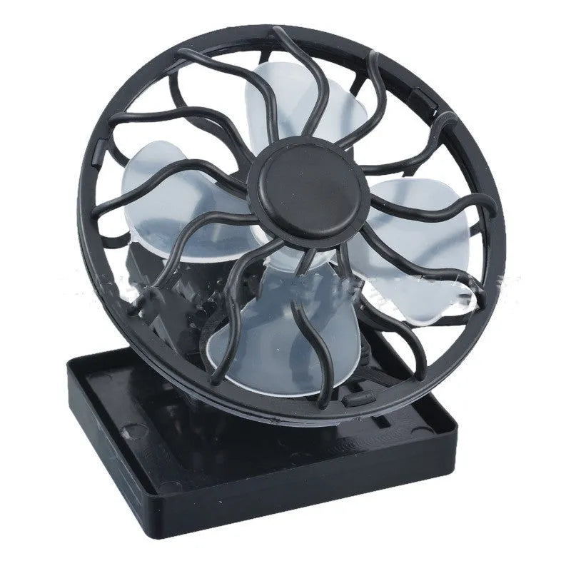 Black portable solar panel fan with a clip, shown outdoors for camping cooling.