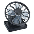 Black portable solar panel fan with a clip, shown outdoors for camping cooling.