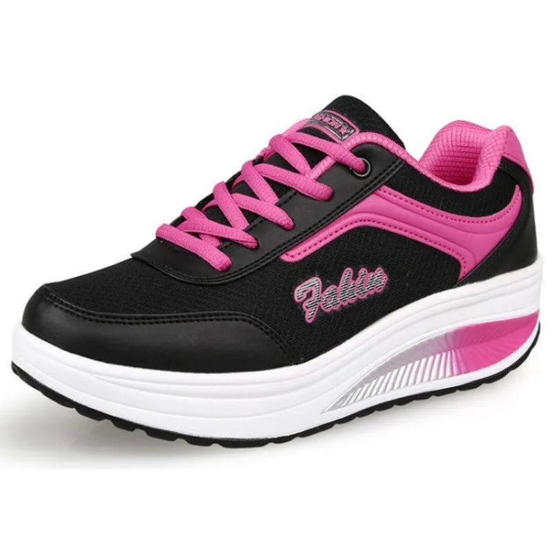 Women's low-heel sports shoe in a choice of colours including black, blue, pink, and purple.