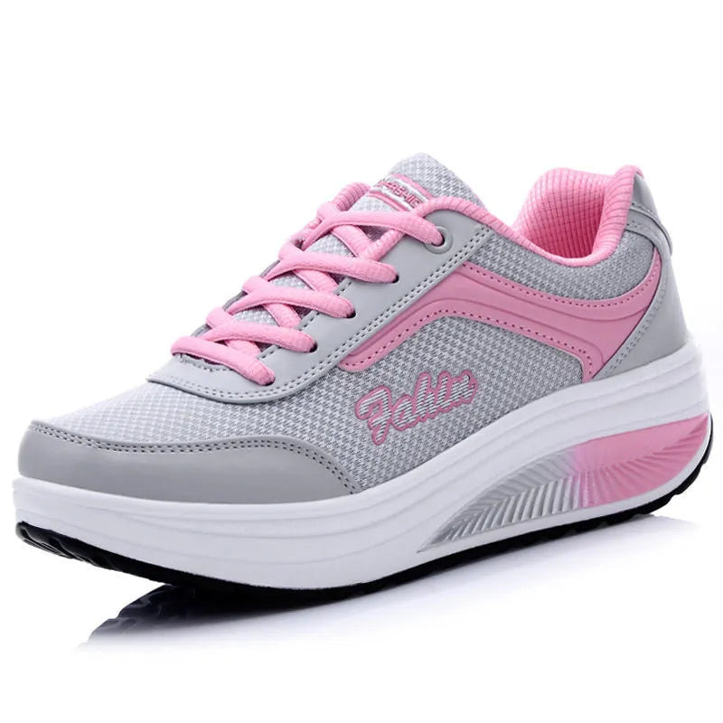 Women's low-heel sports shoe in a choice of colours including black, blue, pink, and purple.