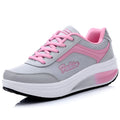 Women's low-heel sports shoe in a choice of colours including black, blue, pink, and purple.