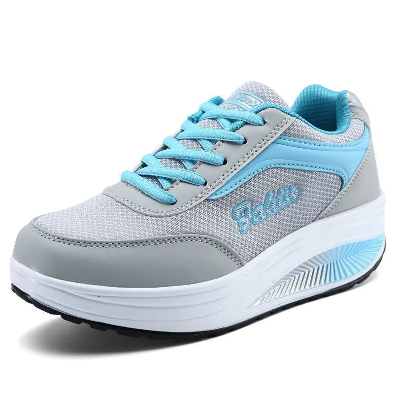 Women's low-heel sports shoe in a choice of colours including black, blue, pink, and purple.