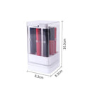 White press-lift lipstick storage box with dust cover on a desktop, showing multiple compartments.